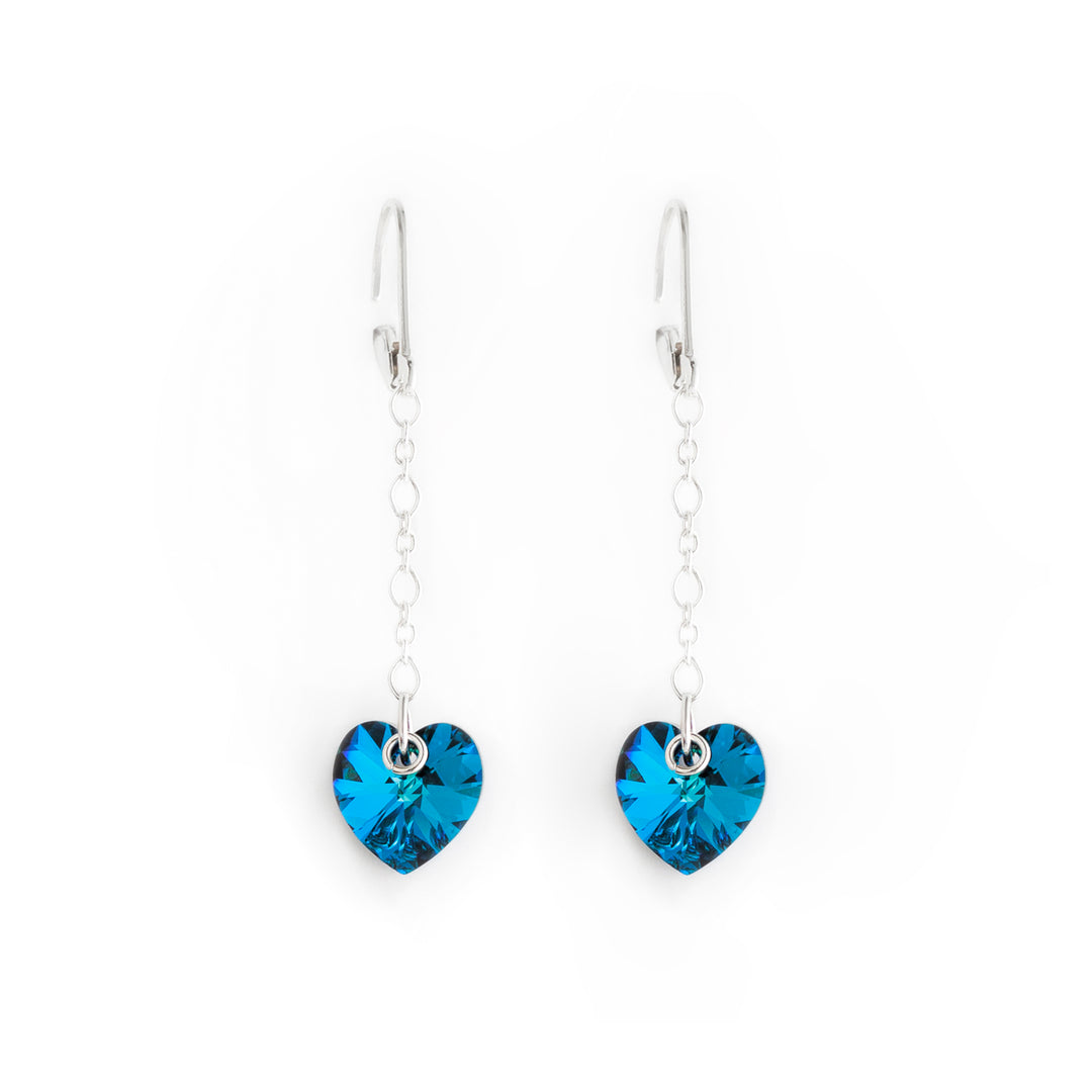 Stunning lever back drop earrings handcrafted by artist Debra Nelson. Made of sterling silver and Bermuda Blue Swarovski Crystal. Each earring measures 1.88" x 0.38" including hook.