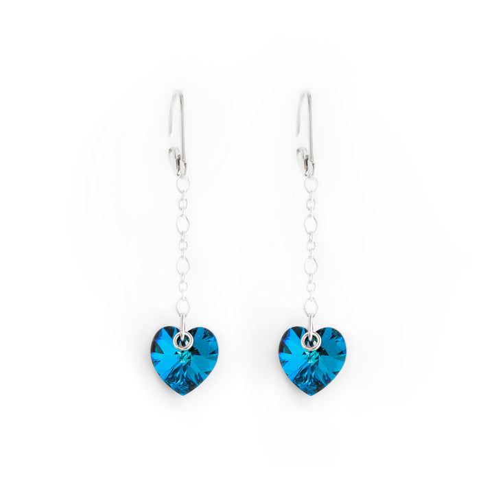 Stunning lever back drop earrings handcrafted by artist Debra Nelson. Made of sterling silver and Bermuda Blue Swarovski Crystal. Each earring measures 1.88" x 0.38" including hook.