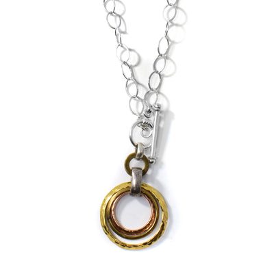Bronze, Brass and Copper Rings on Silver Necklace