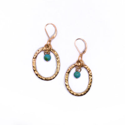 Unique lever-back turquoise earrings handcrafted by artist Karley Smith. She used gold-filled hooks, gold-plated adornments and hammered oval bronze hoops to create them. Each earring measures 2" x 1" including hook.