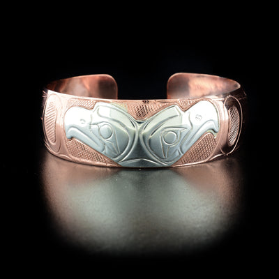 Copper and Sterling Silver Double Eagle Bracelet hand-carved by Kwakwaka'wakw artist Norman Seaweed. Bracelet is 7.30" long with 0.70" gap and has width of 0.75".