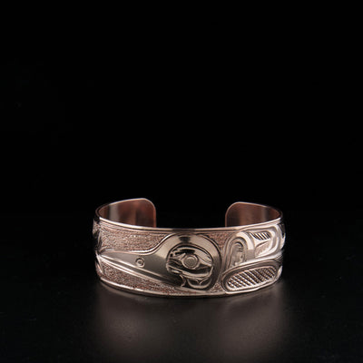 Copper hummingbird bracelet hand-carved by artist Paddy Seaweed.
