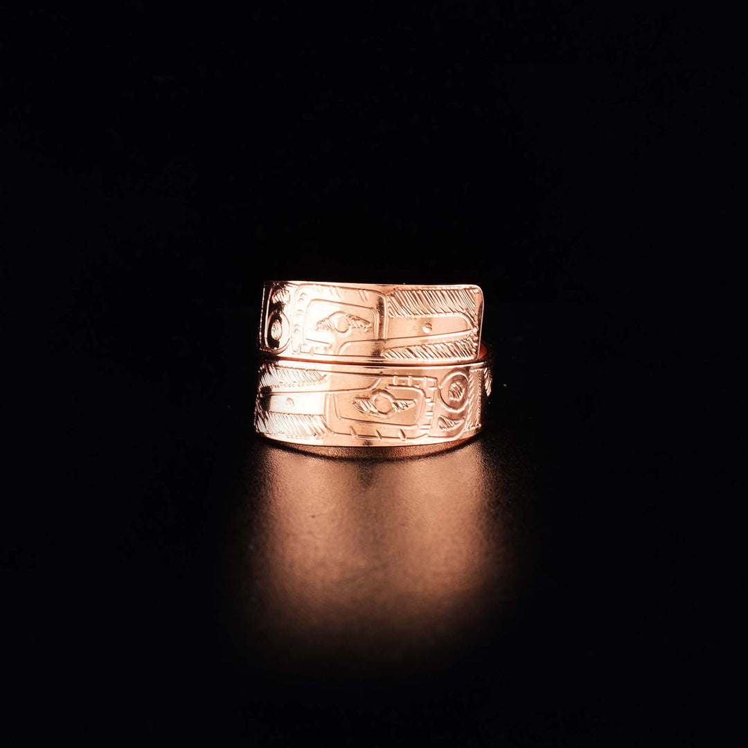This Hummingbird ring is made from copper and has a single band that wraps around the finger twice. There is a depiction of the Hummingbird carved into the surface of the band.