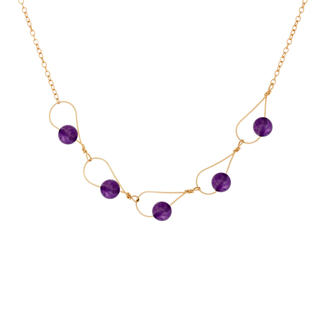 This elegant and unique amethyst bed necklace is made from 14K gold fill and amethyst gemstone. The bottom portion of the necklace is made form large, teardrop shaped links and the rest of the piece has a dainty chain. There are five amethyst beads linked through the large chain links.