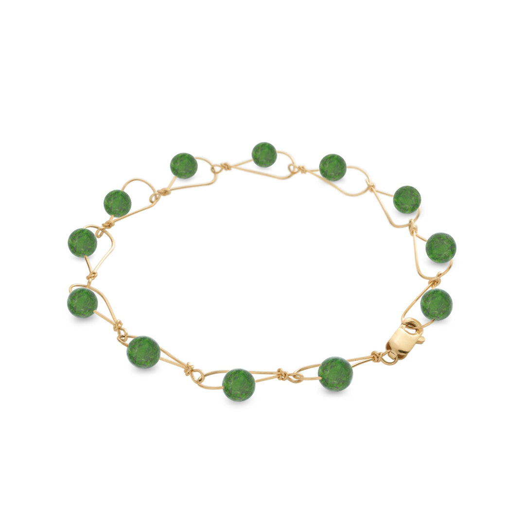 This unique jade bracelet is made from 14K gold fill and genuine BC jade. The chain links are large, teardrop shaped and have jade beads linked through them.