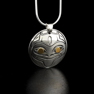 Circle frog pendant by Tahltan artist Grant Pauls. Made of 18K gold and sterling silver. Pendant measures 1.2" x 1.1" including bail. Chain not included.