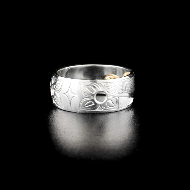 Hummingbird ring pendant hand-carved by Haisla artist Hollie Bartlett. Made of sterling silver and 14K gold. Width of band is 0.38". Can be worn as either ring or pendant. Size 9.