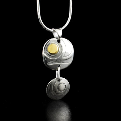 Dazzling two-piece salmon egg pendant by Tahltan artist Grant Pauls. Made of 18K gold and sterling silver. Pendant measures 1.20" x 0.60" including bail. Chain not included.