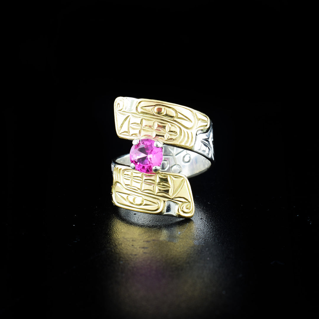 Wolf wrap ring hand-carved by Coast Salish and Cree artist Richard Lang. Made of sterling silver, 14K gold and a lab-grown stone. Band is 0.31" wide, with the flexible wrap design giving the ring a comfortable fit. Size 7.