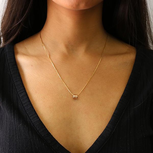 Gold Hummingbird charm. Paired with a gold chain necklace on Indigenous model. 14K Gold Hummingbird Spirit Bead