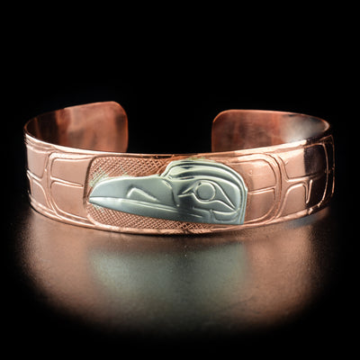 1/2" Copper and Sterling Silver Raven Bracelet hand-carved by Kwakwaka'wakw artist Norman Seaweed. Bracelet is 7.3" long with 0.6" gap and has width of 0.5".