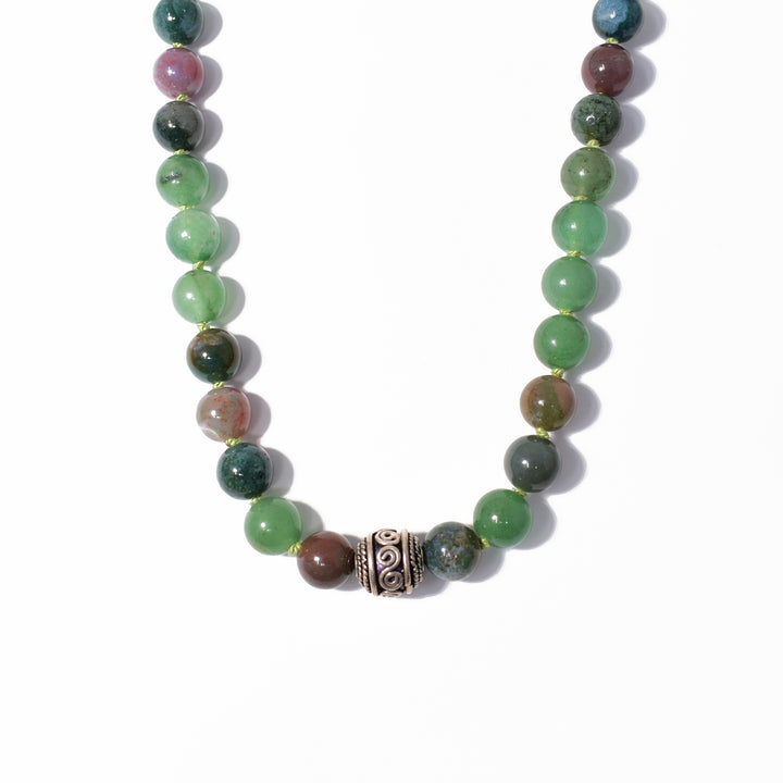 Unique beaded necklace hand-crafted by artist Debra Nelson. Made of African jade, sterling silver and Indian agate. Central bead has been oxidized. Necklace is 24" long.