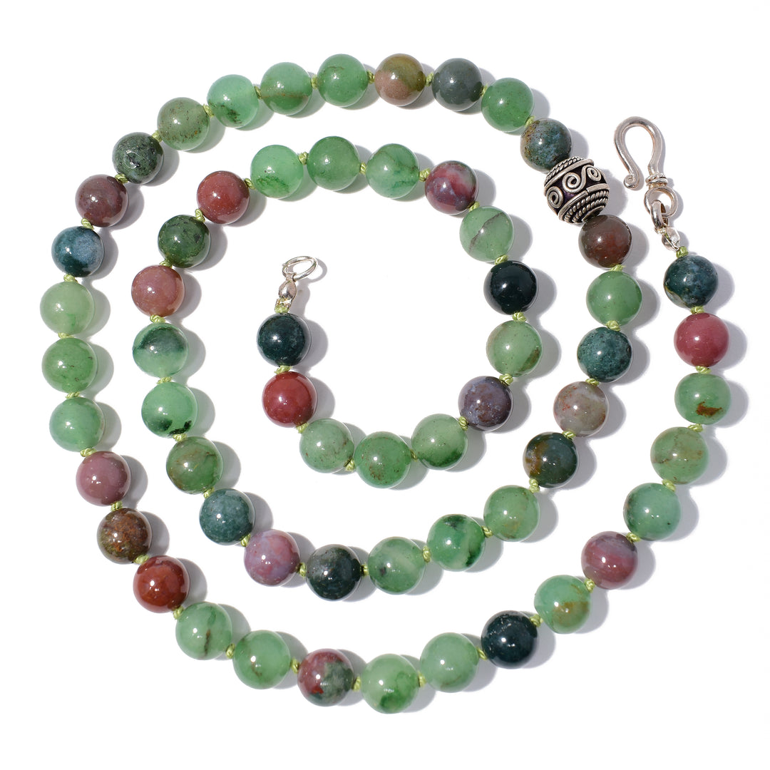 Unique beaded necklace hand-crafted by artist Debra Nelson. Made of African jade, sterling silver and Indian agate. Central bead has been oxidized. Necklace is 24" long.