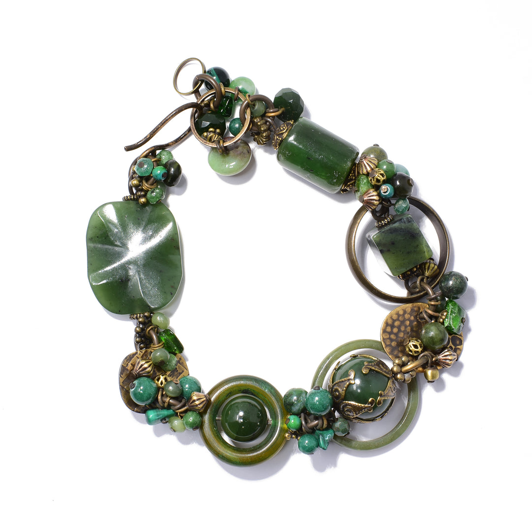 Chunky brass and jade bead bracelet handcrafted by artist Honica. Made of handworked brass, chrome diopside, chrysocolla, aventurine, horn, BC jade and malachite. 9.25" long and 0.95" at its widest, will comfortably fit a 6.25" to 6.50" wrist.