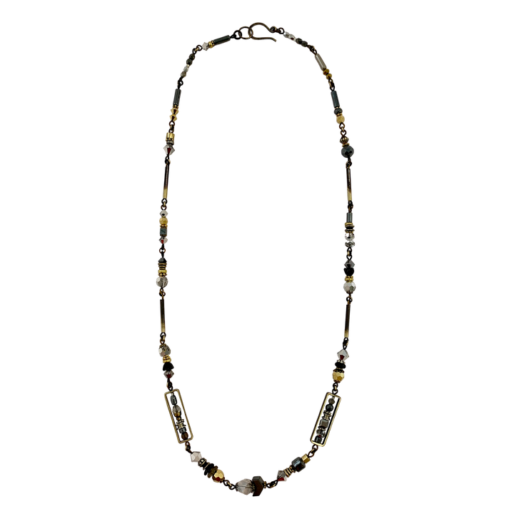 This unique crystal bead necklace is made from hand worked brass, glass, hematine and Austrian crystals. The chains and attachments are made form brass and the necklace is made form unique beads of serval different materials and shapes. 