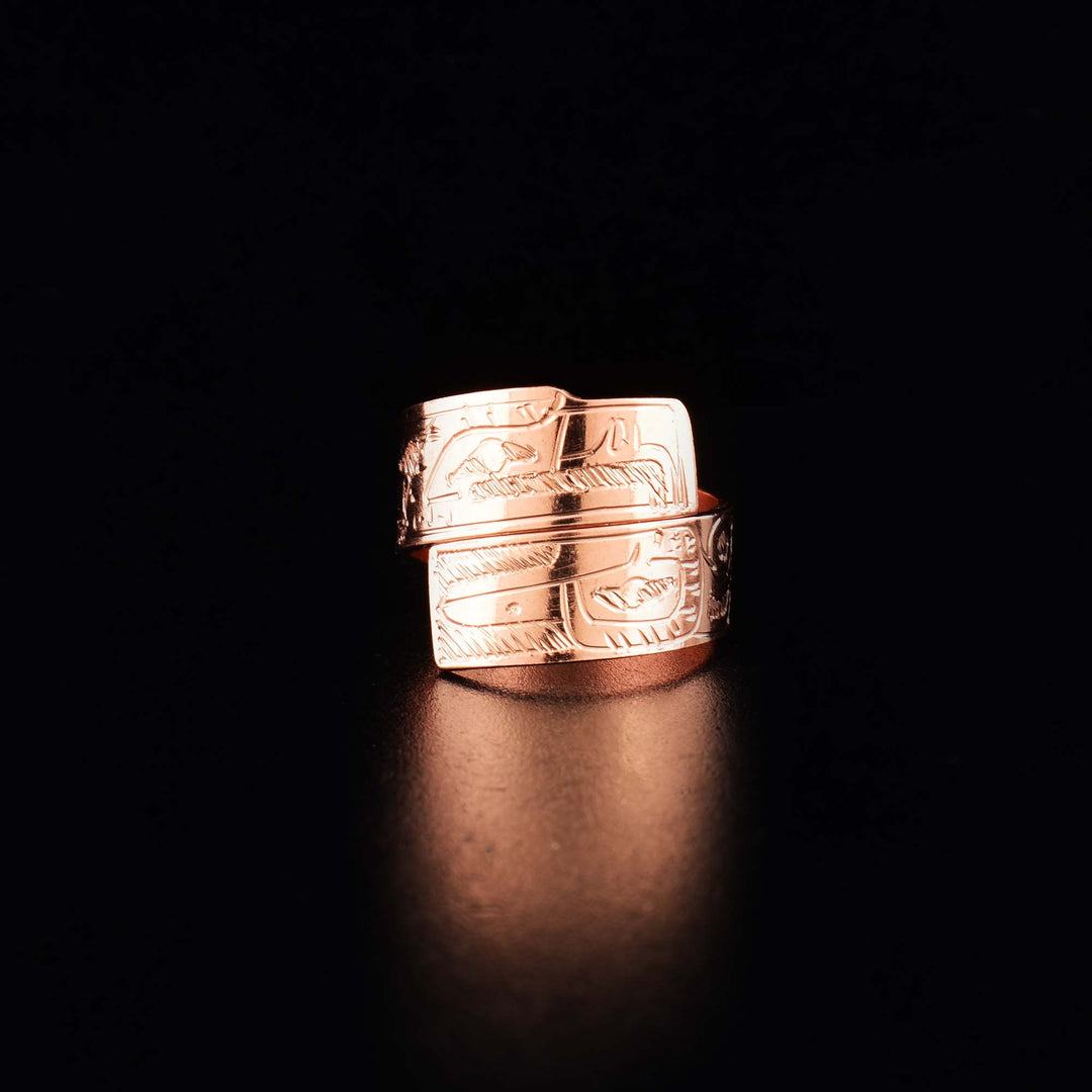 This copper wrap around ring has a single band that wraps around the finger twice. There are depictions of the Hummingbird and the Eagle carved into the band of this wrap ring.