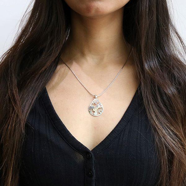 These dangling, diamond shaped earrings are made from sterling silver and have cutout designs on the hangs that depict the Eagle.