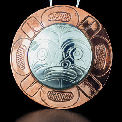 Large Copper and Silver Moon Pendant hand-carved by Kwakwaka'wakw artist Norman Seaweed. Made of sterling silver and copper. Pendant is 2.5" in diameter. Hidden bail on back. Chain not included.