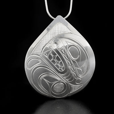 Stunning large teardrop orca pendant hand-carved by Kwakwaka'wakw artist Don Lancaster. Made of sterling silver. Pendant measures 2.31" x 1.94". Hidden bail on back. Chain not included.
