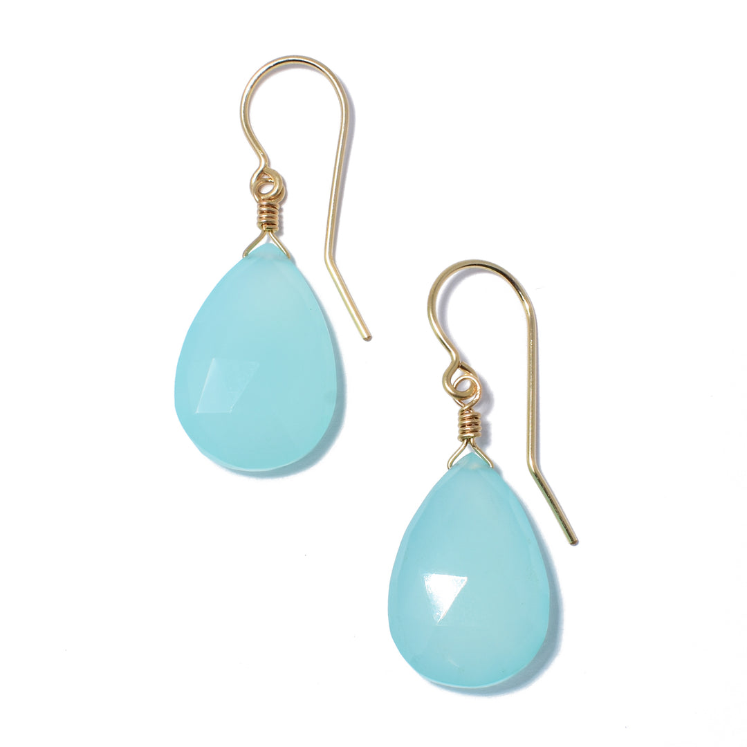 Elegant Light Blue Chalcedony Teardrop Earrings handcrafted by artist Debra Nelson. She has used light blue chalcedony and 14K gold fill wire and ear hooks to create them. Each earring measures 1.50" x 0.56" including hook.