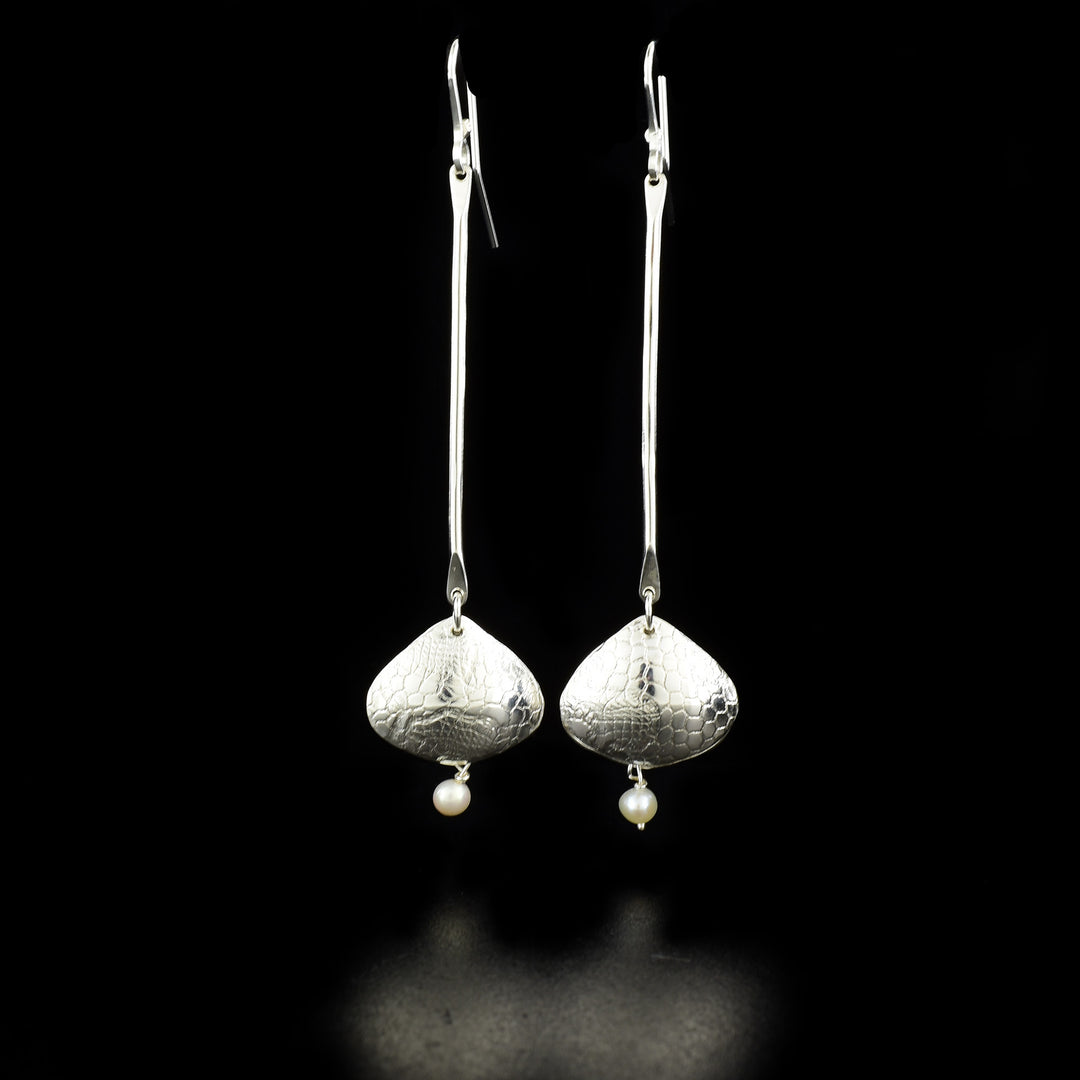 Elegant Long Freshwater Pearl Shoreline Earrings handcrafted by artist Victoria Poynton. Made of sterling silver and freshwater pearls. Victoria has used vintage French lace to emboss the design. Each earring measures 3.25" x 0.75" including hook.