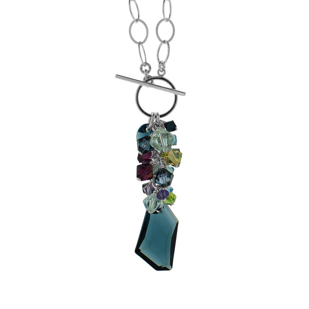 Long Swarovski Crystal Pendant Necklace handcrafted by artist Karley Smith. She has used a dark blue crystal as the main feature with a grouping of smaller crystals above for the pendant. Chain and toggle clasp are sterling silver. Pendant is 2.3" (6 cm) in length including toggle clasp and chain is 18" long.