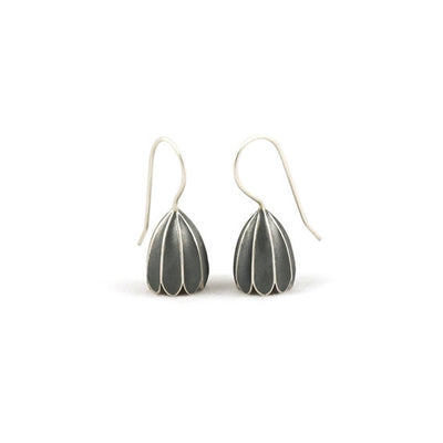 Delicate Oxidized Silver Bell Earrings handcrafted by artist Dushka Vujovic. She has used sterling silver to create the oxidized the petals. Each earring measures approximately 0.88" x 0.38" including hook.