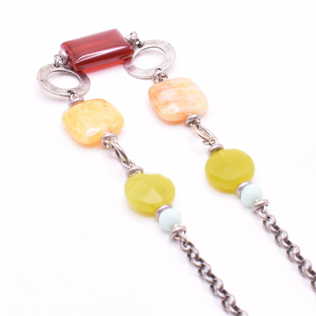 Unique necklace handcrafted by artist Karley Smith. Gemstones are carnelian agate, yellow jade, yellow turquoise and amazonite. Chain and ring adornments are oxidized silver. Necklace is 20" long.