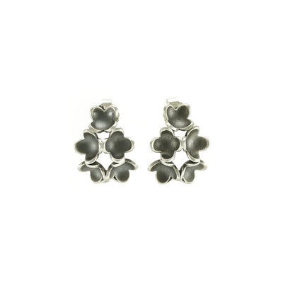 Oxidized Sterling Silver Six Flower Cluster Stud Earrings handcrafted by artist Dushka Vujovic. Flowers have four petals and are arranged in a pyramid shape. Each earring measures 0.69" x 0.50".