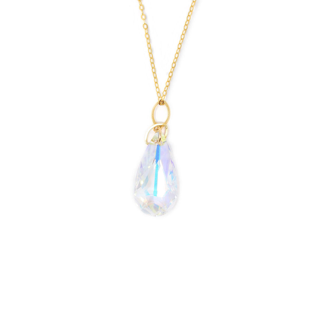 Pendant made of a large Aurora Borealis Swarovski Crystal and 14K gold fill adornments. 14K gold fill chain included. Pendant measures 1.25" x 0.50" including bail. Chain is 18" long with 2" extender. By Debra Nelson.