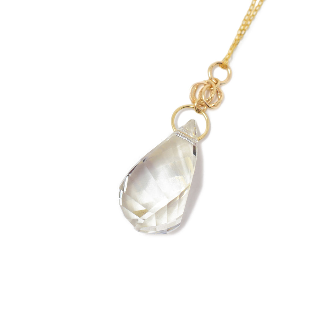 Pendant made of a large Silver Shade Swarovski Crystal and 14K gold fill adornments. 14K gold fill chain included. Pendant measures 1.75" x 0.50" including bail. Chain is 18" long with 2" extender. By Debra Nelson.