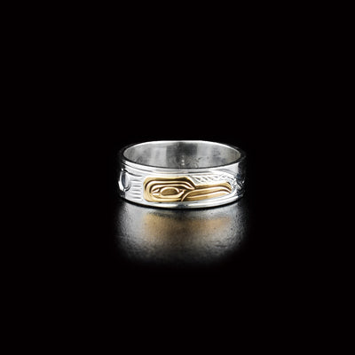 Dazzling hummingbird ring hand-carved by Kwakwaka'wakw artist Victoria Harper. Made of sterling silver and 14K gold. Width of band is 0.25".
