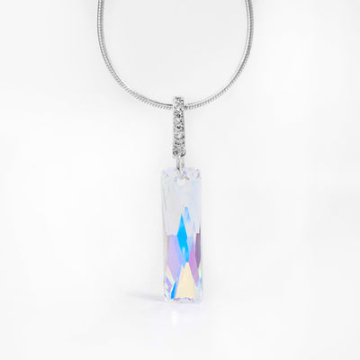 Queen's Baguette Crystal Pendant with Cubic Zirconia Bail handcrafted by artist Debra Nelson. Made of sterling silver, cubic zirconia and Aurora Borealis Swarovski Crystal. Pendant measures 1.50" x 0.31" including bail. Chain is not included.