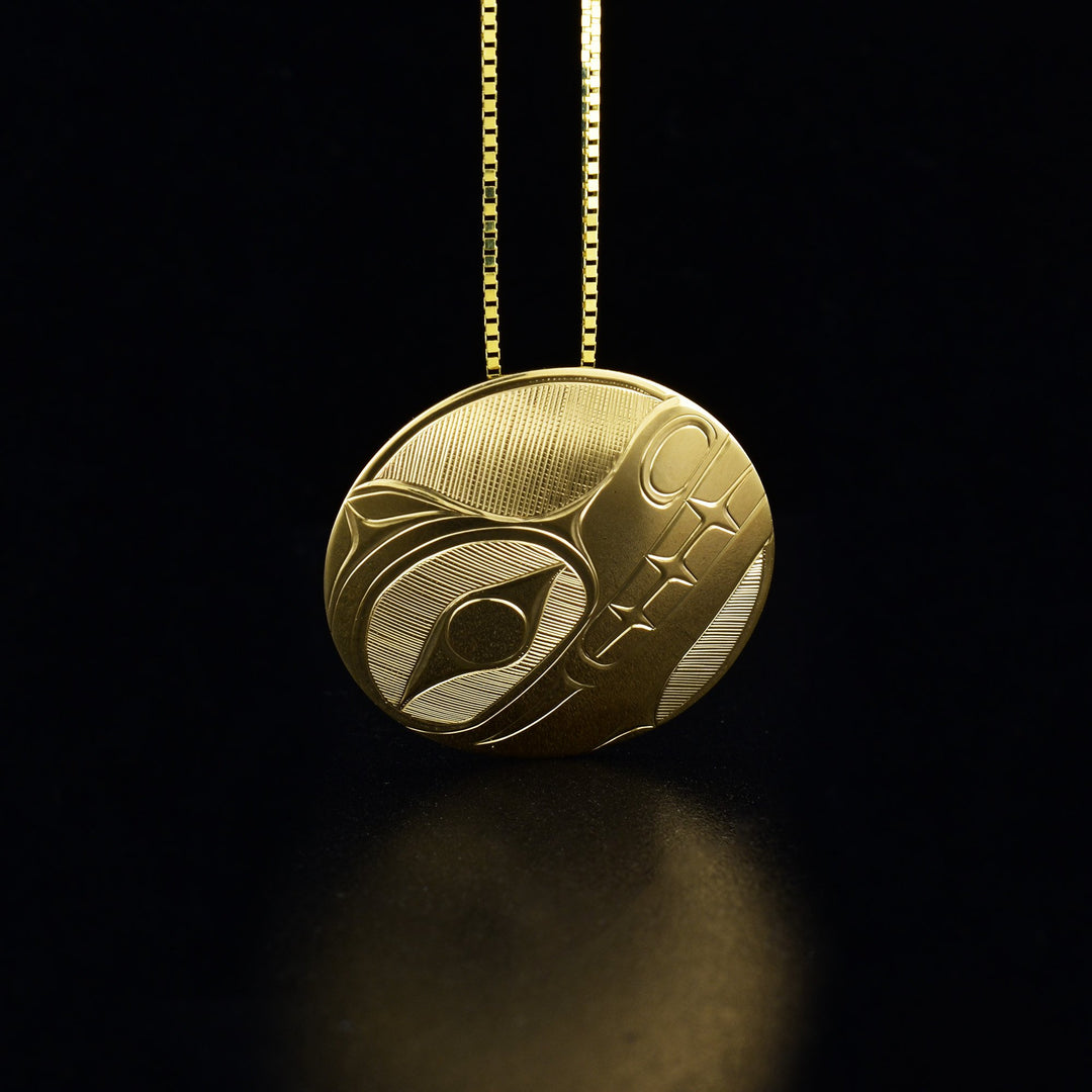 14K gold round bear pendant hand-carved by Haisla artist Hollie Bartlett.