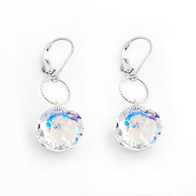 Dazzling lever-back earrings handcrafted by artist Debra Nelson. Made of sterling silver and Aurora Borealis Swarovski Crystal. Each earring measures 1.63" x 0.50" including hook.
