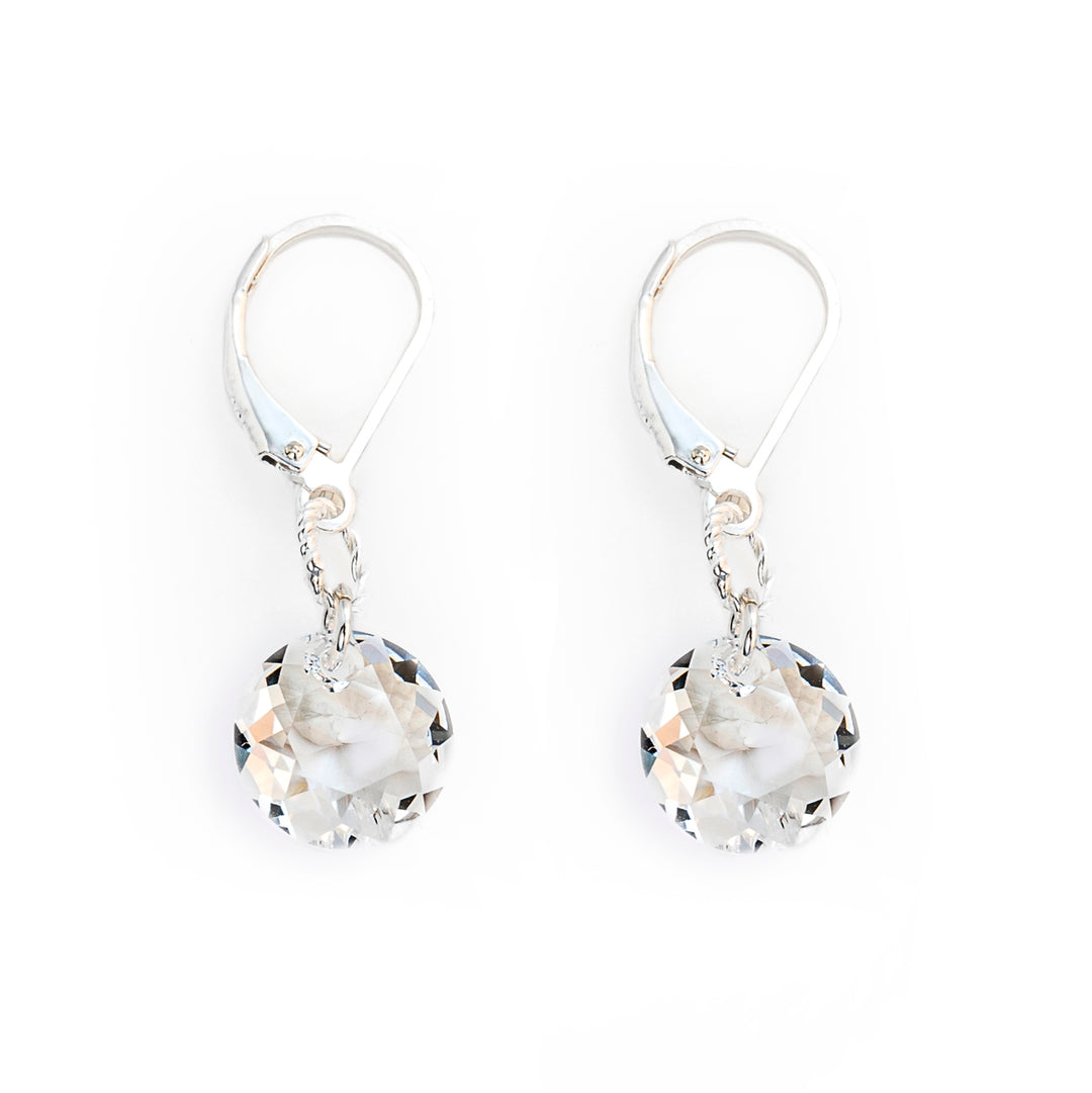 Delicate lever back earrings handcrafted by artist Debra Nelson. Made of Swarovski Crystal and sterling silver. Each earring measures 1.25" x 0.38" including hook.