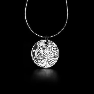 Round Sterling Silver Bear Pendant hand-carved by Kwakwaka'wakw artist Victoria Harper. Pendant measures approximately 0.80" x 0.70" including bail. Chain not included.