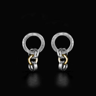 Silver and Gold Kindness Single Stud Earrings handcrafted by artist Lynda Constantine. Made of sterling silver and 14K gold. Large silver circles have dented effect. Each earring measures 0.80" x 0.40".