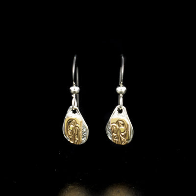 Teardrop bear earrings hand-carved by Kwakwaka'wakw artist Carrie Matilpi. Made of sterling silver and 14K gold. Each earring measures 1" x 0.30" including hook.