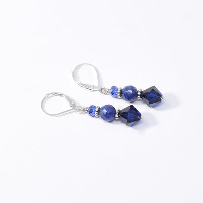 Dazzling lever back earrings handcrafted by artist Karley Smith. Made of sterling silver, oxidized silver, Swarovski Crystal and sodalite. Ear hooks are sterling silver. Each earring measures 1.30" x 0.25" including hook.