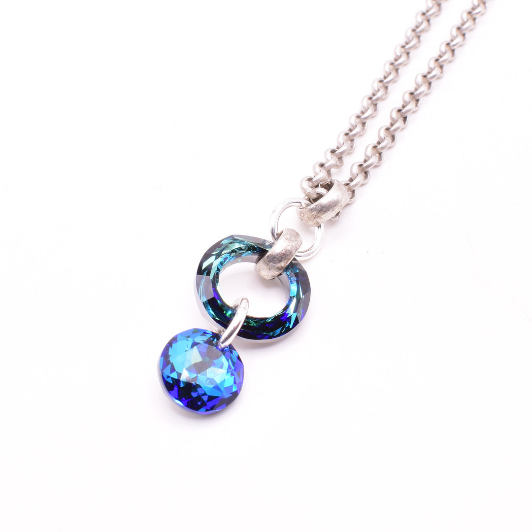 Small Crystal Ring and Circle Pendant Necklace handcrafted by artist Karley Smith. Pendant made of sterling silver, antique silver and Swarovski Crystal. Antique silver rolo chain included. Pendant measures 1.55" x 0.60" including bail and chain is 20" long.