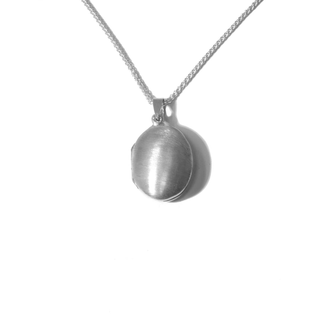 This Small Oval Satin Locket is handmade by artist Pamela Lauz. The locket measures 1.18" x 0.6". The chain is not included.