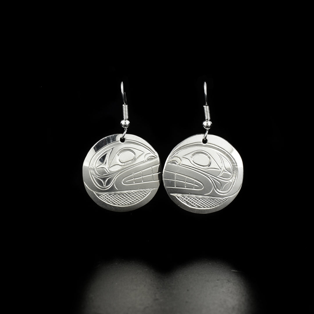 Sleek orca earrings hand-carved by Kwakwaka'wakw artist Don Lancaster. Made of sterling silver. Each earring measures 1.6" x 1" including hook.