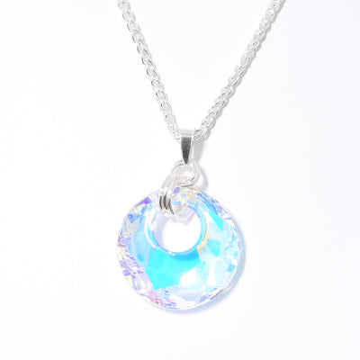 Small Victory Swarovski Crystal Medium Pendant handcrafted by artist Debra Nelson. Made of sterling silver and Aurora Borealis Swarovski Crystal. Pendant measures 1.69" x 1.13" including bail. Chain not included.