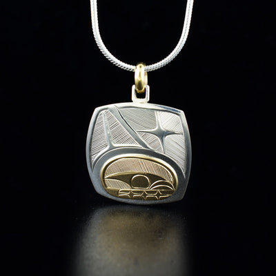 Sterling silver and 14K gold whale pendant with 10K gold jump ring hand-carved by Haisla artist Hollie Bartlett. Pendant measures 1.13" x 0.88" including bail. Chain not included.