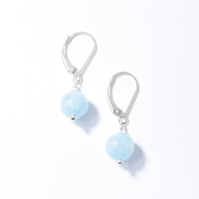 Delicate lever back earrings handcrafted by artist Debra Nelson. Made of sterling silver and aquamarine. Each earring measures 1.13" x 0.31" including hook.