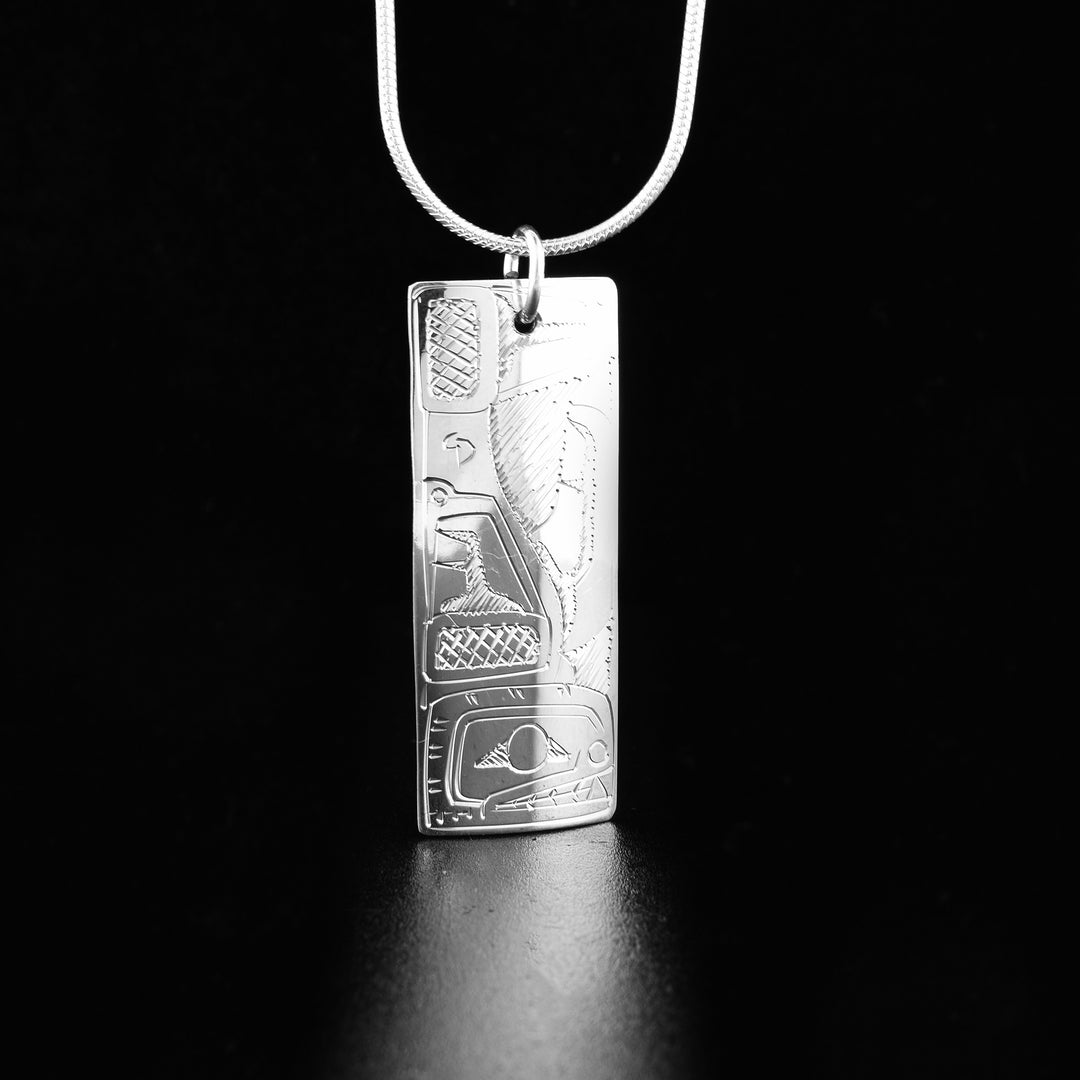 This gorgeous Orca and Bear pendant is made form sterling silver and has a long, rectangular shape. There are brilliant depictions of the Bear and the Orca carved into either side of this double sided pendant.