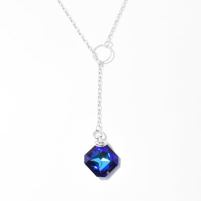 Sterling Silver Bermuda Blue Lariat Necklace handcrafted by artist Debra Nelson. Made of Bermuda Blue Swarovski Crystal and sterling silver. Lariat pendant measures 2.50" x 0.56". Chain is 17.50" long.