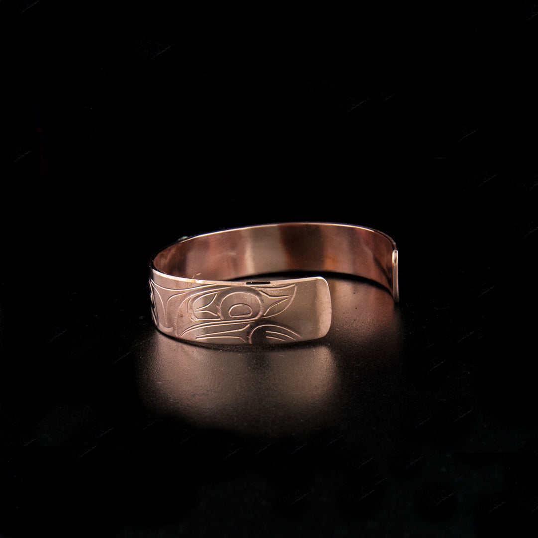 Sterling silver and copper bear bracelet hand-carved by Kwakwaka'wakw artist John Lancaster. 6.13" long with 1.13" gap. 0.50" wide.
