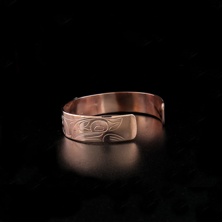 Sterling silver and copper bear bracelet hand-carved by Kwakwaka'wakw artist John Lancaster. 6.13" long with 1.13" gap. 0.50" wide.